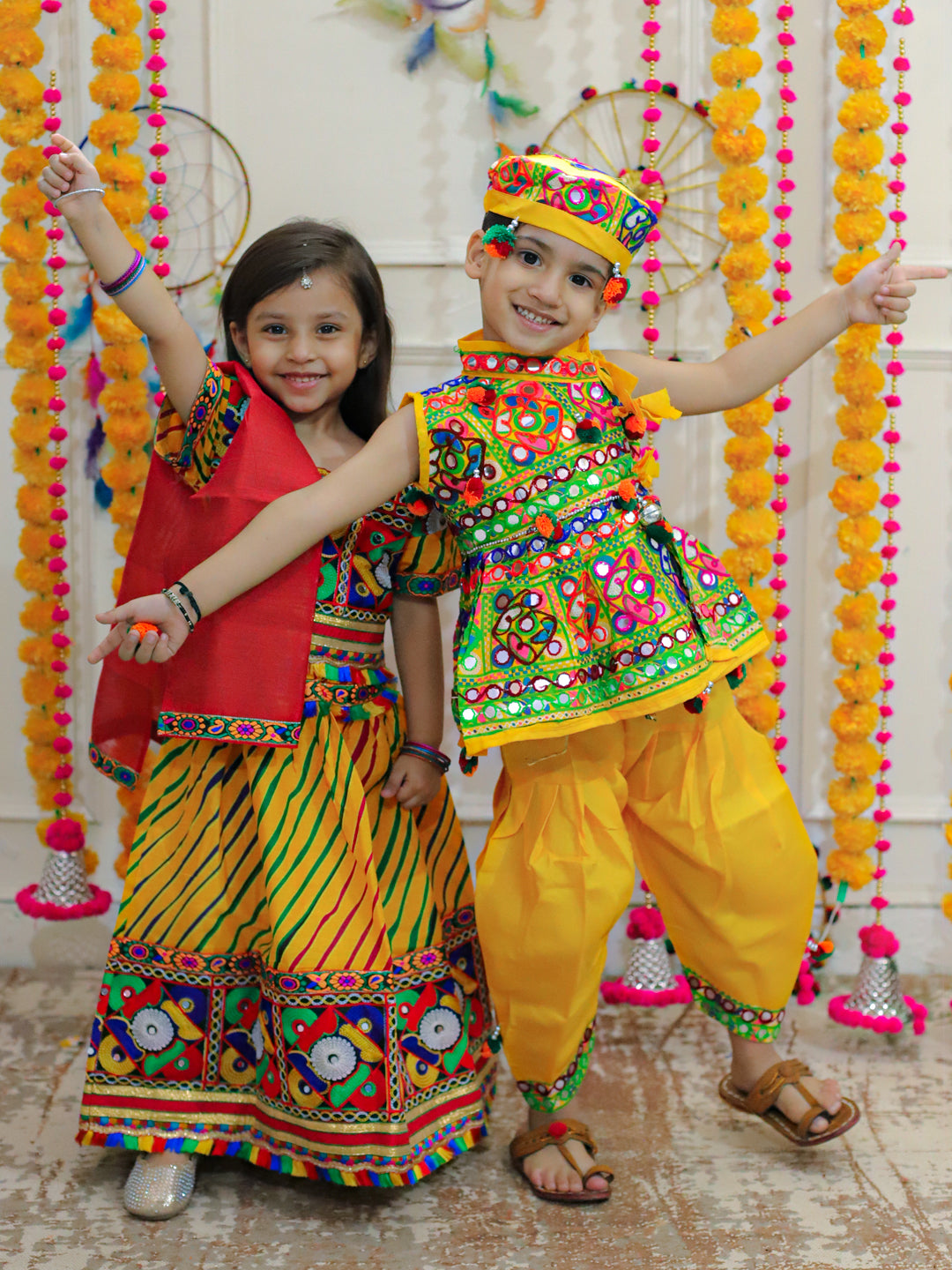 BownBee Sibling Embroidered kediya with Dhoti and Cap for Boys and Leheria Print Cotton Lehnga Choli with Dupatta- Yellow