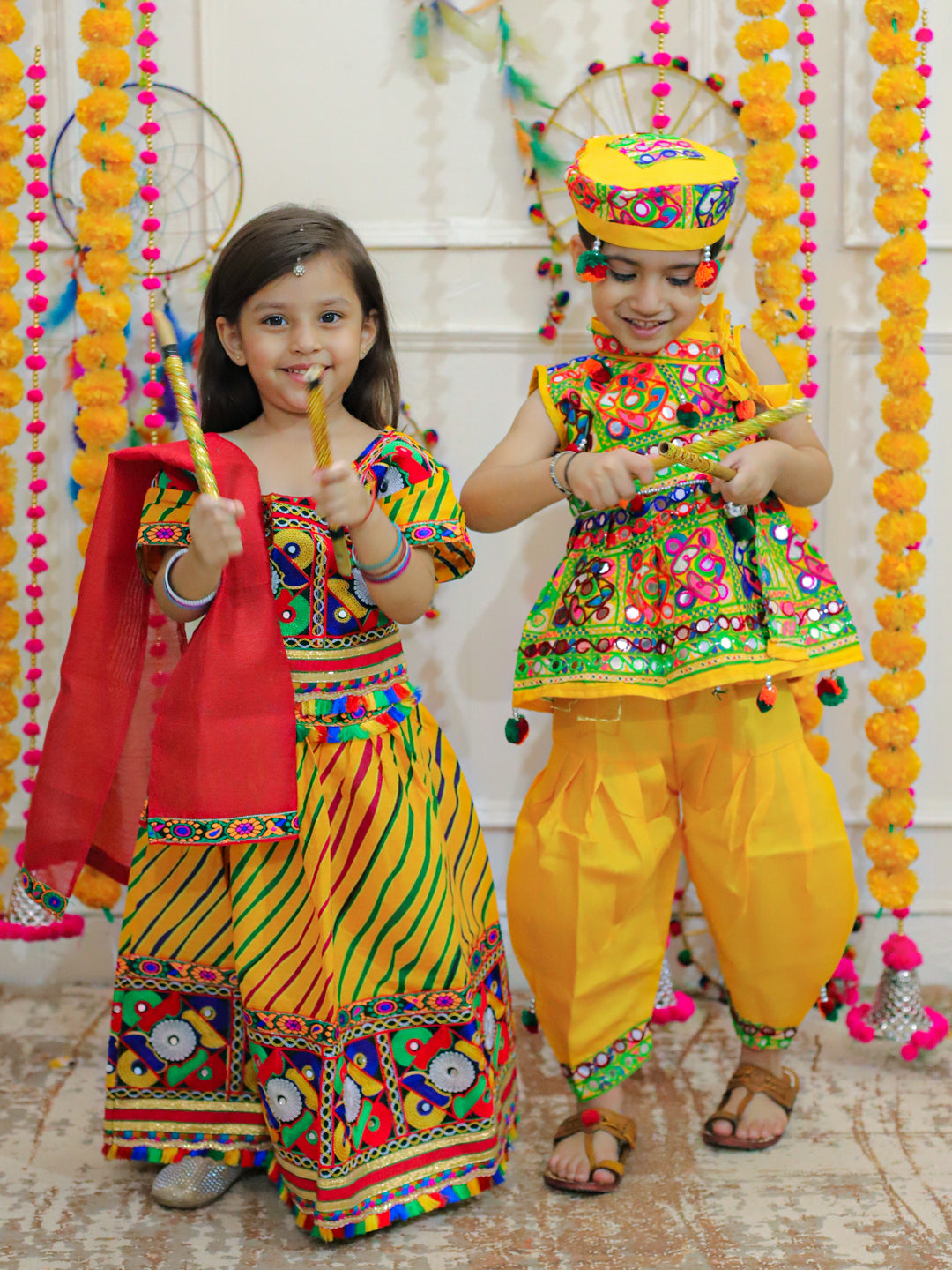 BownBee Sibling Embroidered kediya with Dhoti and Cap for Boys and Leheria Print Cotton Lehnga Choli with Dupatta- Yellow