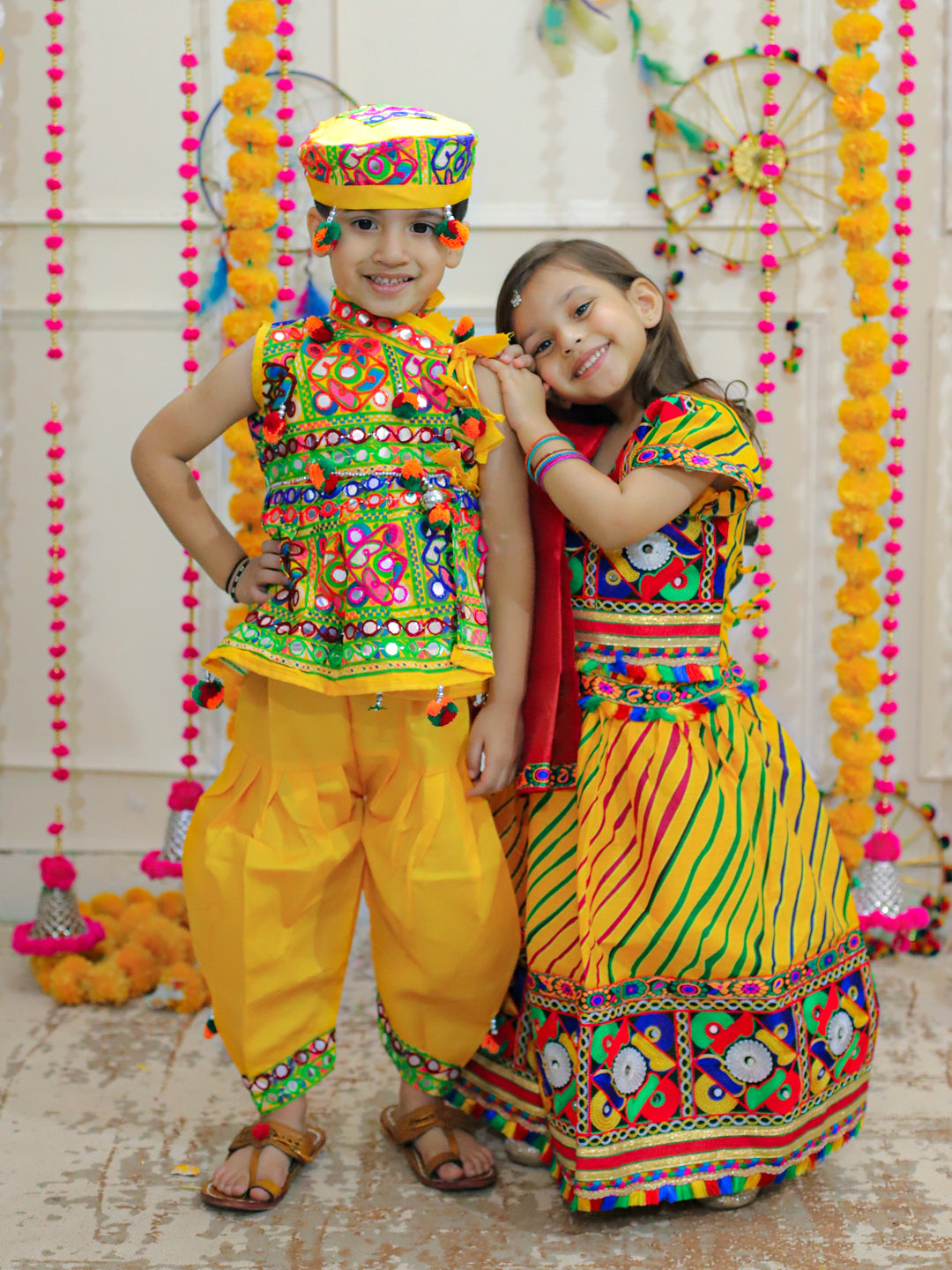 BownBee Sibling Embroidered kediya with Dhoti and Cap for Boys and Leheria Print Cotton Lehnga Choli with Dupatta- Yellow