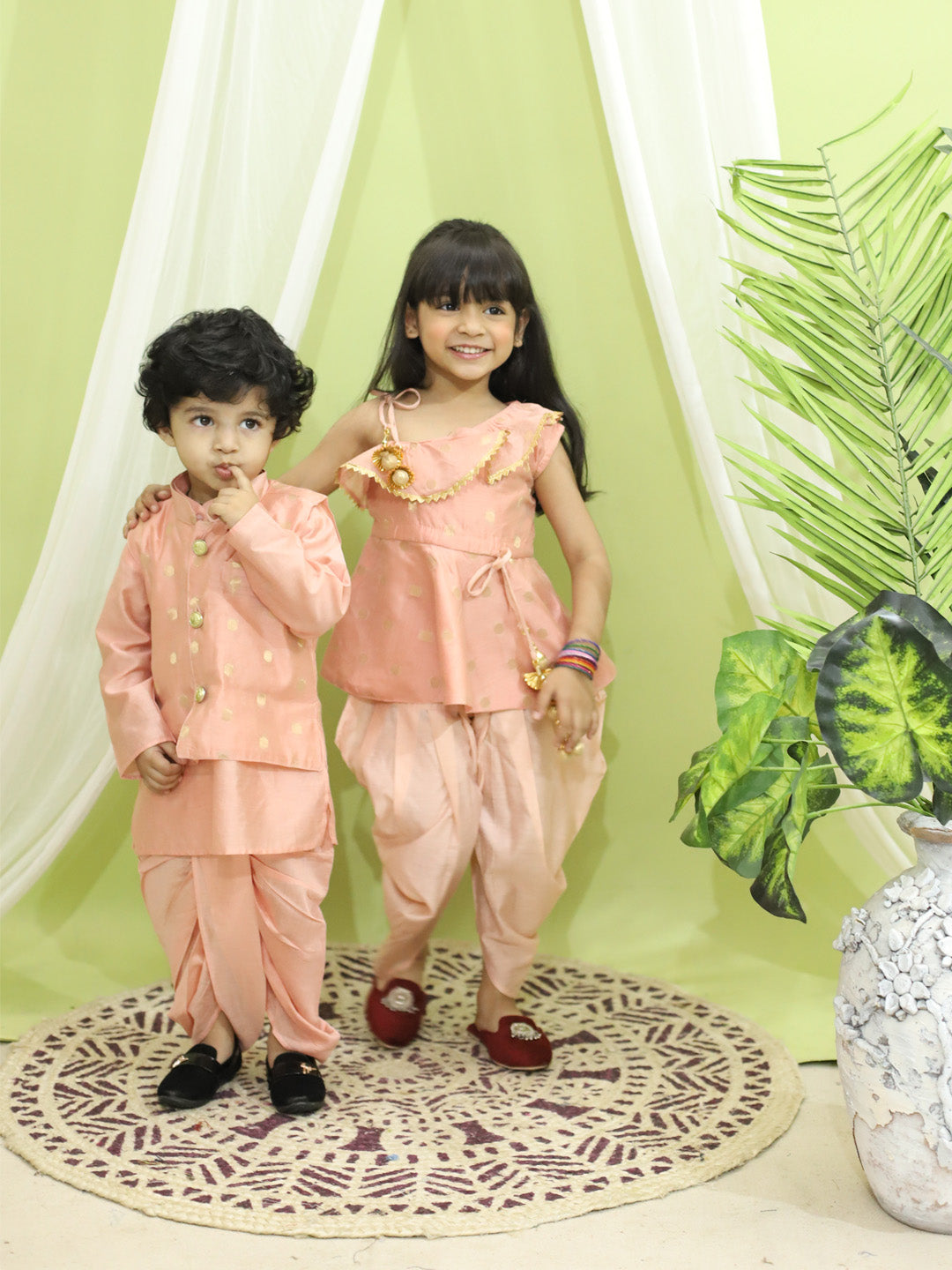 BownBee Chanderi Jacket with Chanderi Dhoti Kurta for Boys and One Shoulder Chanderi Silk  Peplum with Dhoti for Girls- Peach