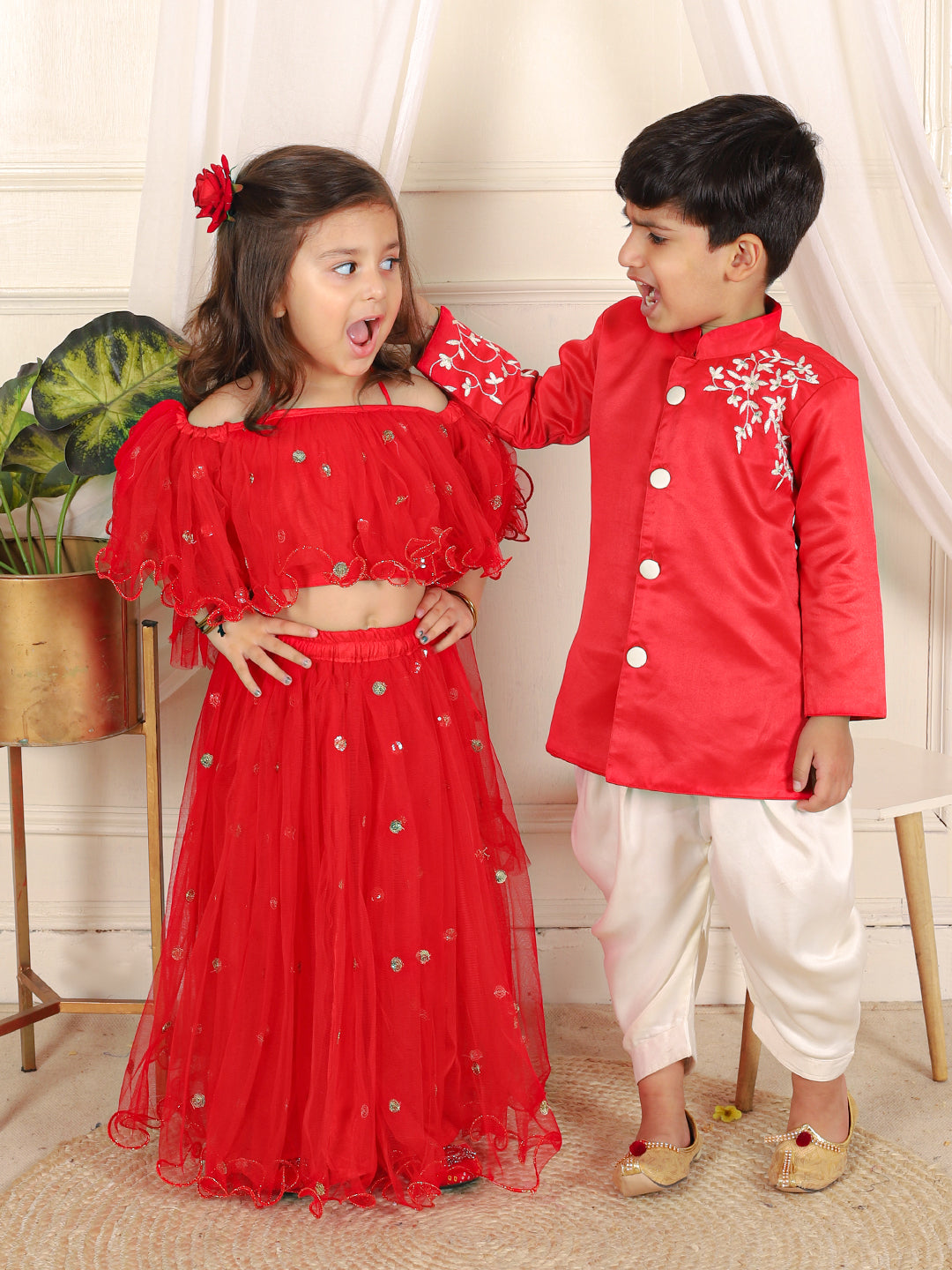 BownBee Sibling Set Hand Embroidered Jam Cotton Sherwani Salwar For Boys- Red with Sequin Net Lehenga with Ruffle Choli with Dupatta- Red