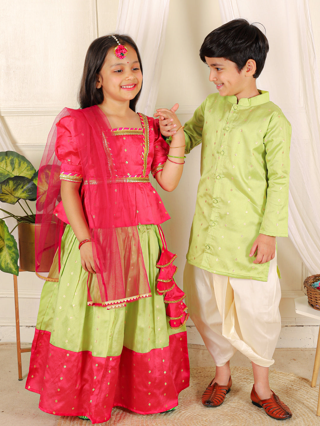 BownBee Sibling Set Full Sleeve Festive Dhoti Kurta for Boys- Green Puff Sleeve Top Lehenga with Dupatta for Girls- Pink
