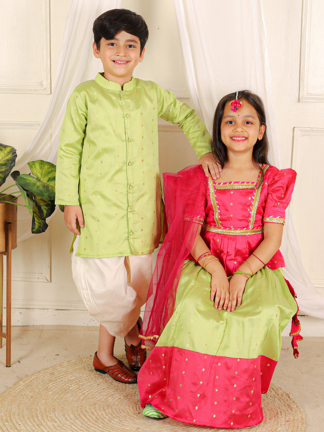 BownBee Sibling Set Full Sleeve Festive Dhoti Kurta for Boys- Green Puff Sleeve Top Lehenga with Dupatta for Girls- Pink