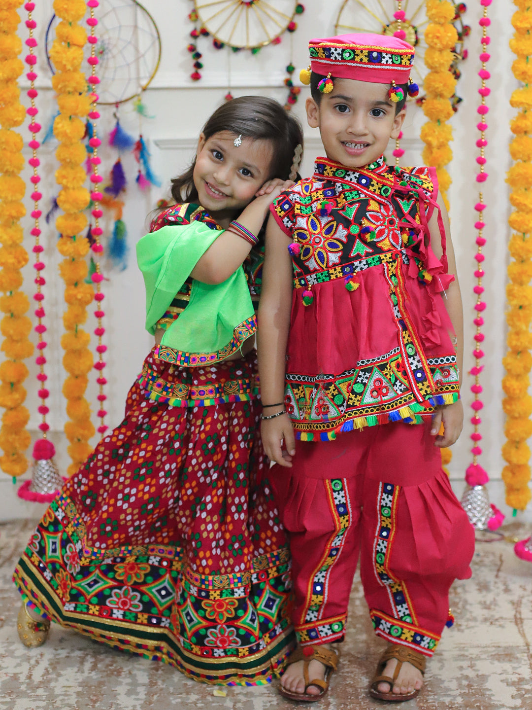 BownBee Sibling Embroidered kediya with Dhoti and Cap for Boys and Bandhani Print Cotton Lehnga Choli- Pink